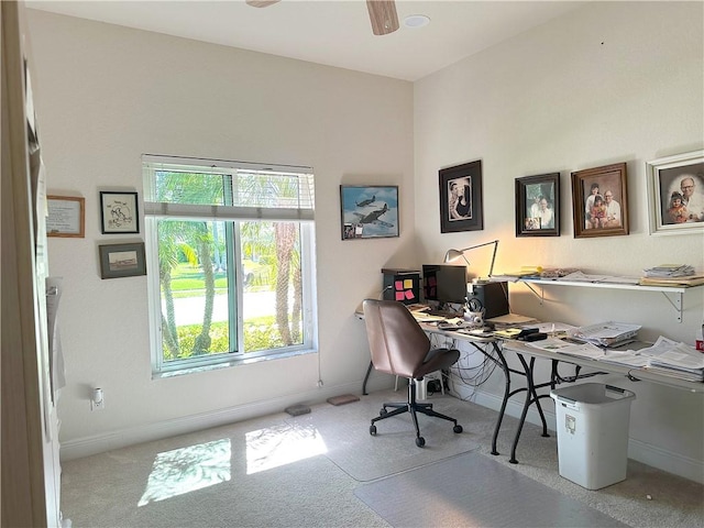 office space featuring a ceiling fan, baseboards, and carpet floors