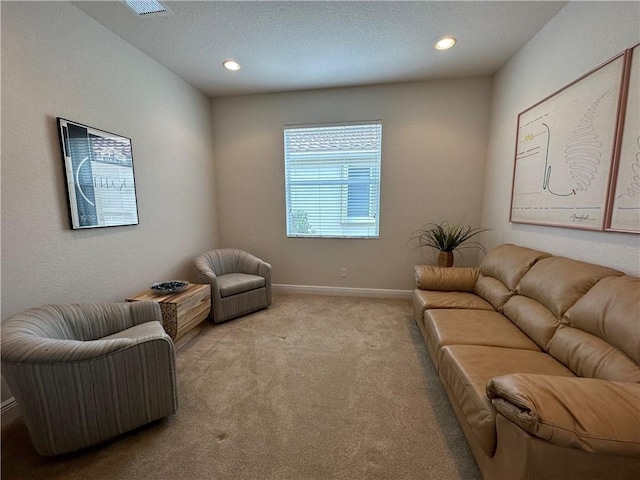 carpeted living room featuring recessed lighting and baseboards