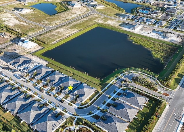 aerial perspective of suburban area featuring a nearby body of water