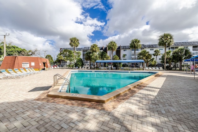 view of swimming pool featuring a patio area