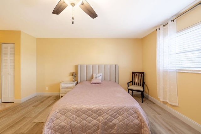 bedroom featuring ceiling fan and light hardwood / wood-style floors