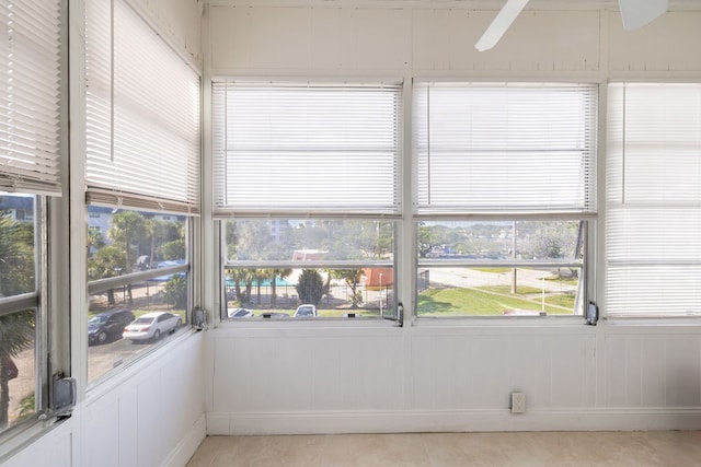 sunroom / solarium with ceiling fan