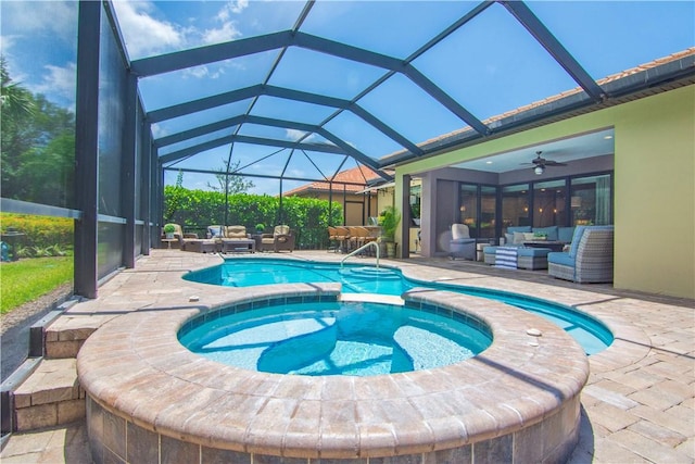 5417 Antigua Cir, Vero Beach, FL 32967 - view of pool with an outdoor living space, a patio, a pool with connected hot tub, a ceiling fan, and a lanai