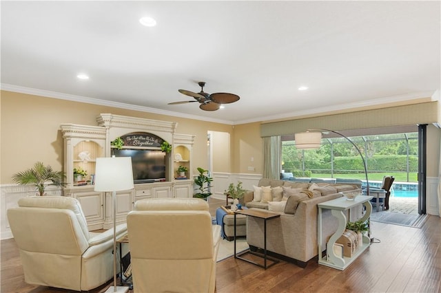 5417 Antigua Cir, Vero Beach, FL 32967 - living room with a ceiling fan, ornamental molding, a wainscoted wall, wood finished floors, and recessed lighting