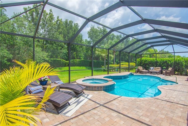 5417 Antigua Cir, Vero Beach, FL 32967 - view of swimming pool featuring an outdoor living space, a pool with connected hot tub, a patio area, and glass enclosure