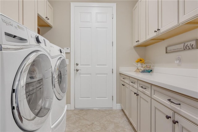 5417 Antigua Cir, Vero Beach, FL 32967 - washroom with washing machine and clothes dryer, cabinet space, light tile patterned floors, and baseboards