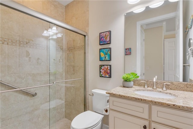 5417 Antigua Cir, Vero Beach, FL 32967 - bathroom featuring vanity, toilet, and a shower stall