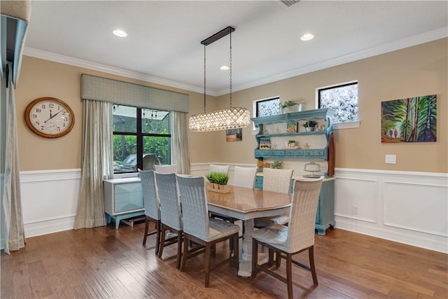 5417 Antigua Cir, Vero Beach, FL 32967 - dining space with plenty of natural light, wainscoting, ornamental molding, wood finished floors, and recessed lighting
