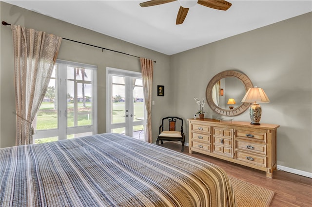 bedroom with ceiling fan, wood-type flooring, french doors, and access to outside