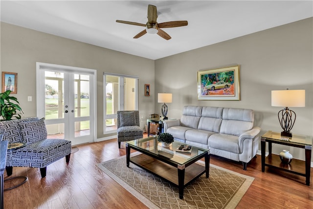 living room with french doors, hardwood / wood-style floors, and ceiling fan