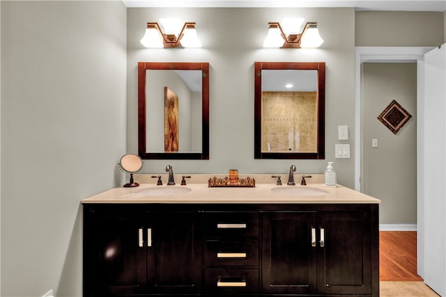 bathroom with wood-type flooring and vanity