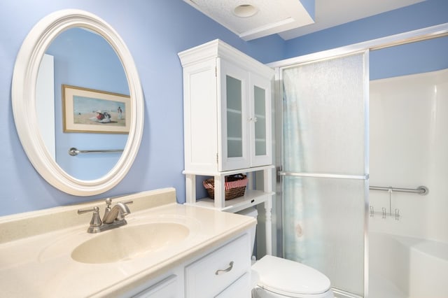 bathroom with vanity, toilet, and an enclosed shower