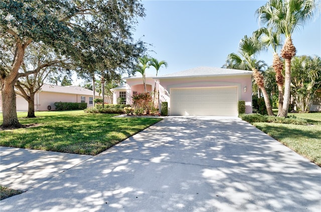 ranch-style home featuring a garage and a front lawn