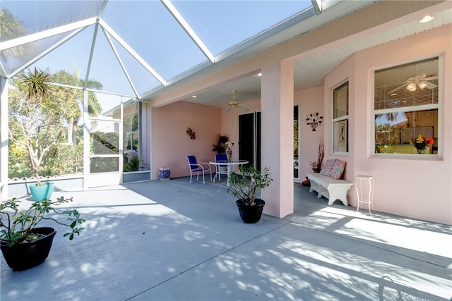 exterior space with a lanai and ceiling fan