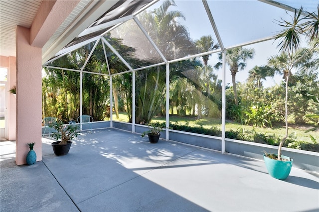 view of patio with glass enclosure