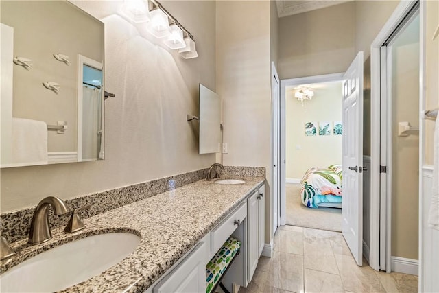 889 Island Club Sq, Vero Beach, FL 32963 - ensuite bathroom with double vanity and baseboards