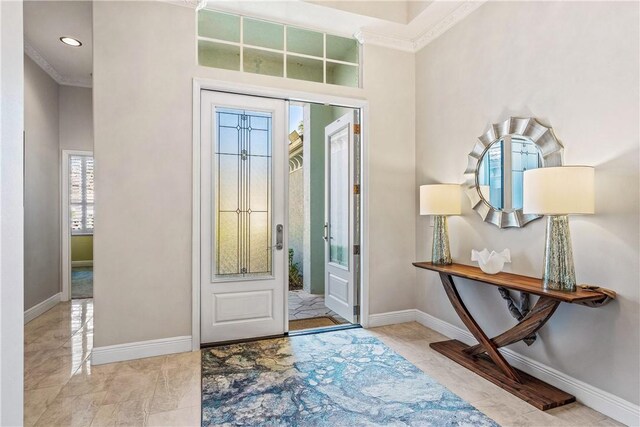 889 Island Club Sq, Vero Beach, FL 32963 - foyer featuring crown molding, baseboards, recessed lighting, and marble finish flooring