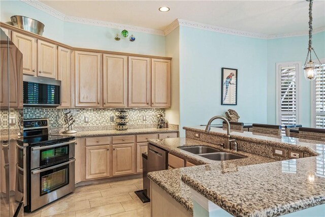 889 Island Club Sq, Vero Beach, FL 32963 - kitchen featuring stainless steel appliances, a sink, light brown cabinetry, backsplash, and light stone countertops