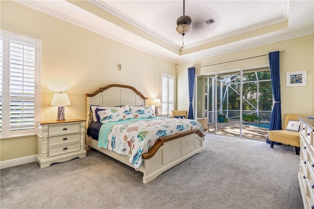 889 Island Club Sq, Vero Beach, FL 32963 - carpeted bedroom with crown molding, access to outside, a raised ceiling, and baseboards