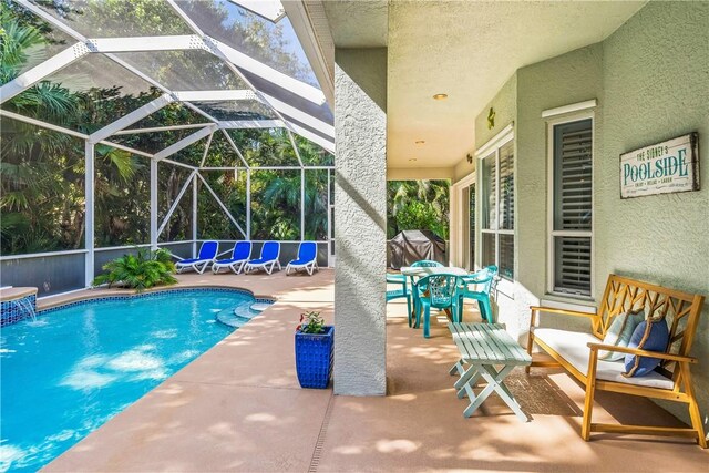 889 Island Club Sq, Vero Beach, FL 32963 - outdoor pool with a patio, outdoor dining area, and glass enclosure