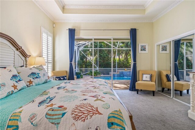 889 Island Club Sq, Vero Beach, FL 32963 - carpeted bedroom featuring access to exterior, ornamental molding, multiple windows, a sunroom, and a closet