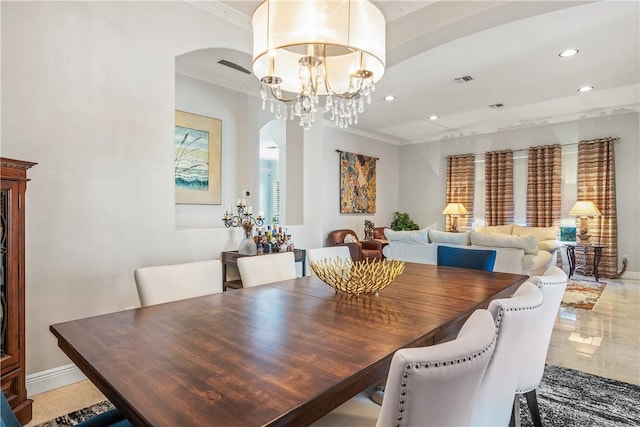 889 Island Club Sq, Vero Beach, FL 32963 - dining space featuring arched walkways, recessed lighting, ornamental molding, a chandelier, and baseboards