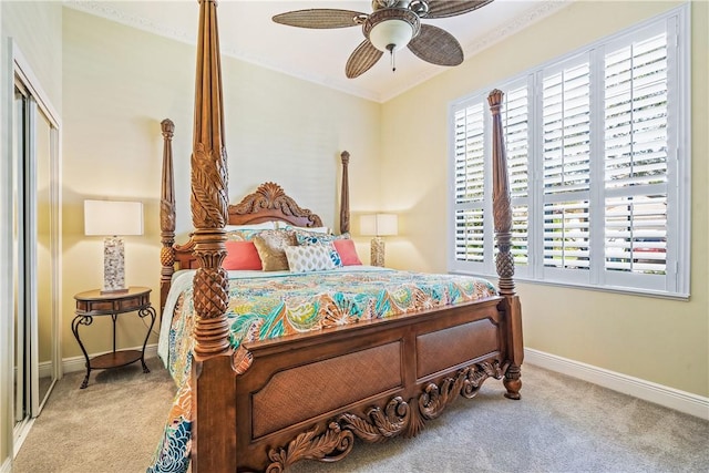 889 Island Club Sq, Vero Beach, FL 32963 - carpeted bedroom featuring baseboards, crown molding, a ceiling fan, and a closet