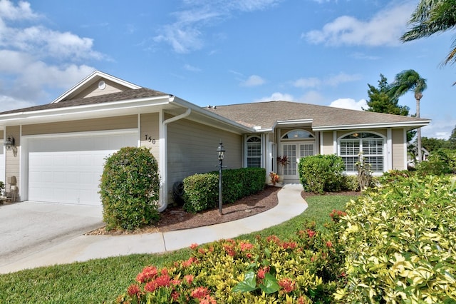 ranch-style house featuring a garage