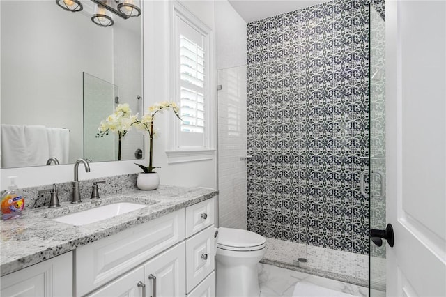 40 White Orchid Way, Vero Beach, FL 32963 - bathroom with marble look tile flooring, toilet, a tile shower, and vanity