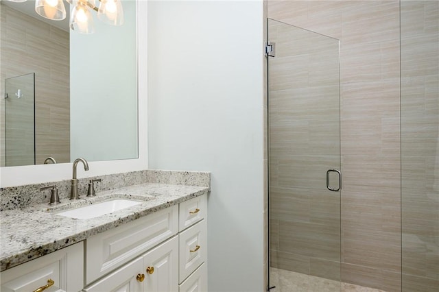 40 White Orchid Way, Vero Beach, FL 32963 - full bath with a stall shower, vanity, and a chandelier