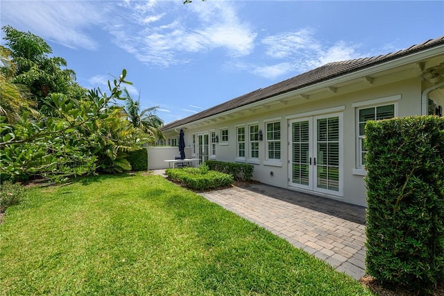40 White Orchid Way, Vero Beach, FL 32963 - view of grassy yard featuring french doors and a patio