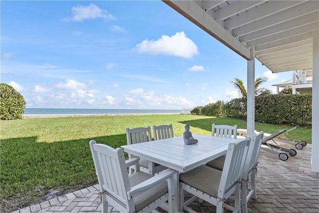 view of patio featuring a water view and a view of the beach