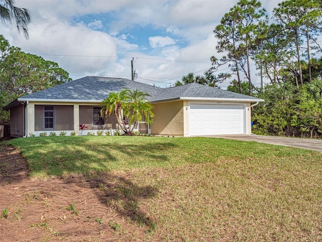 ranch-style home featuring a front lawn and a garage