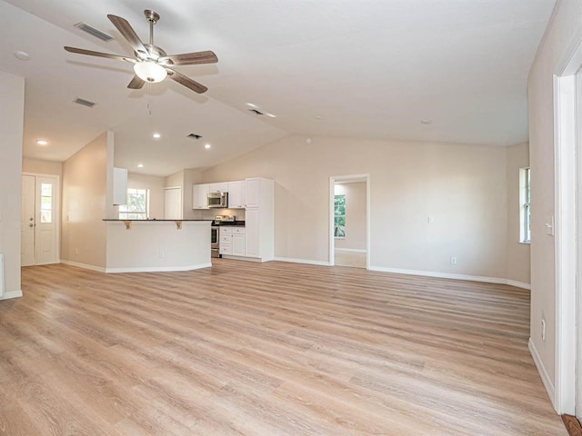 unfurnished living room featuring light hardwood / wood-style floors, lofted ceiling, and ceiling fan