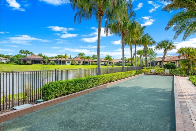 surrounding community featuring a water view