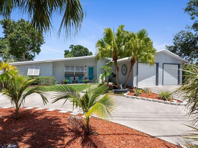ranch-style home with an attached garage and driveway