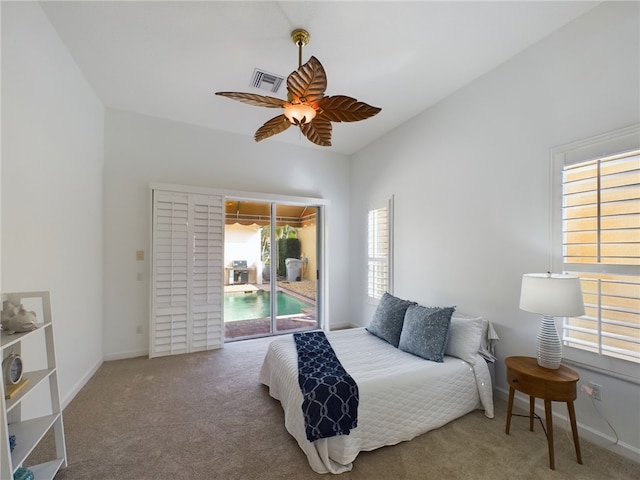 carpeted bedroom featuring access to outside, visible vents, ceiling fan, and baseboards