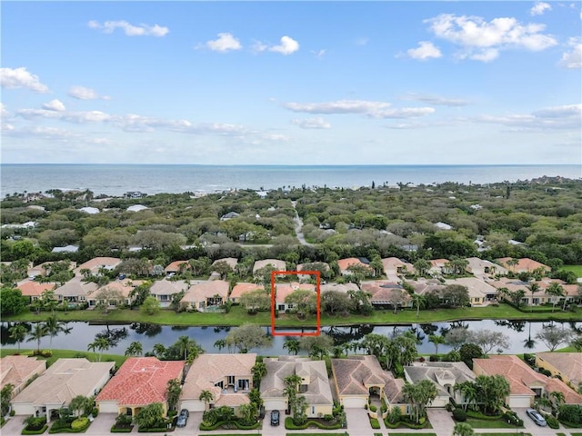 bird's eye view with a water view and a residential view