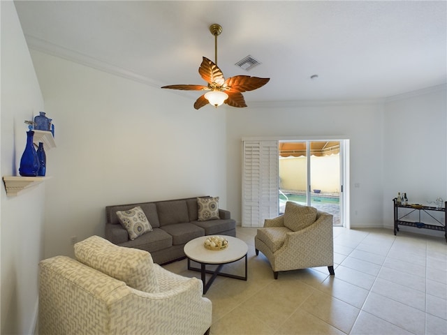 living area with baseboards, visible vents, a ceiling fan, crown molding, and light tile patterned flooring