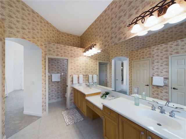 full bath with wallpapered walls, baseboards, toilet, tile patterned floors, and vanity