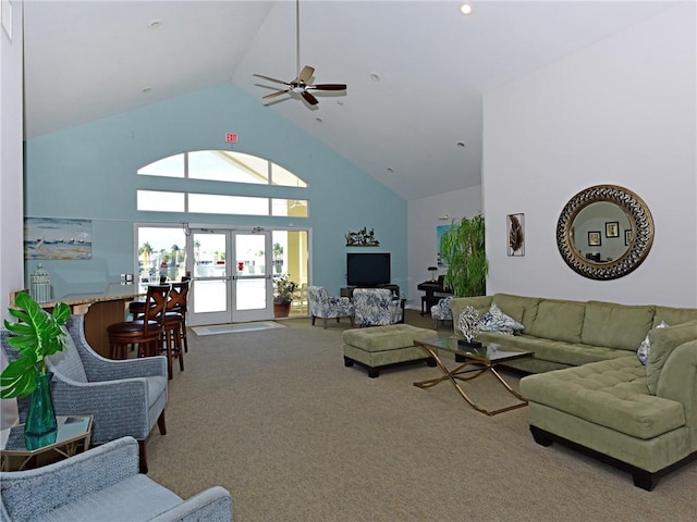 living room with ceiling fan, carpet floors, high vaulted ceiling, and french doors