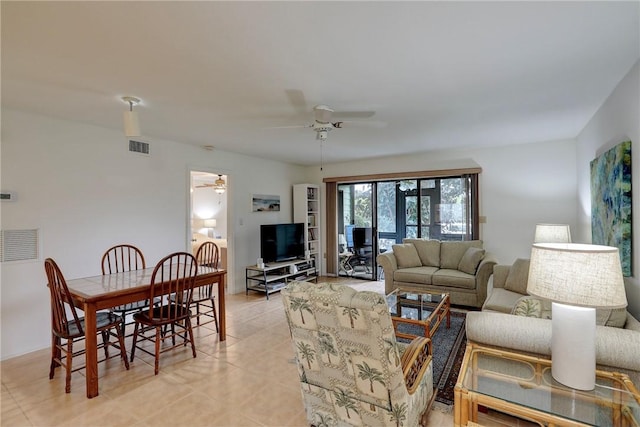 living room with ceiling fan and light tile patterned floors