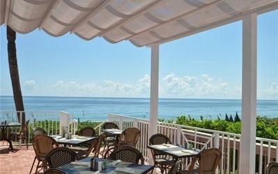 8850 E Orchid Island Cir, Vero Beach, FL 32963 - balcony with a water view and outdoor dining area