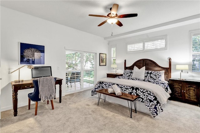 bedroom featuring ceiling fan, access to outside, multiple windows, and light colored carpet