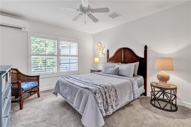 bedroom featuring a wall mounted AC, light colored carpet, and ceiling fan