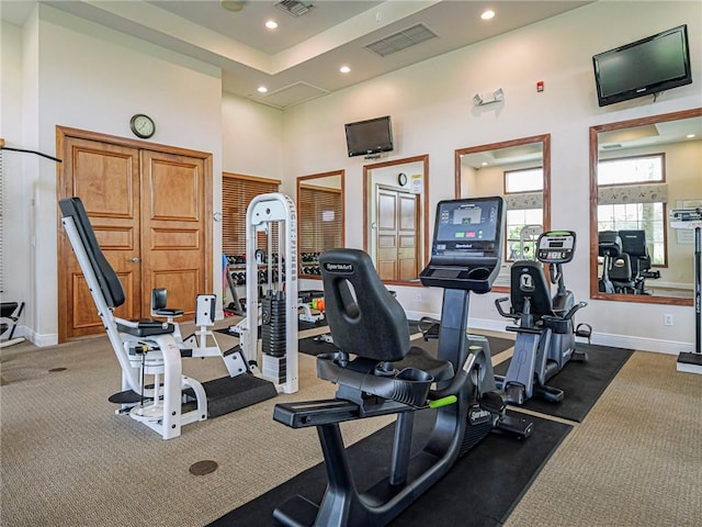 6480 Oxford Cir Unit 103C, Vero Beach, FL 32966 - gym featuring recessed lighting, carpet flooring, a towering ceiling, and baseboards