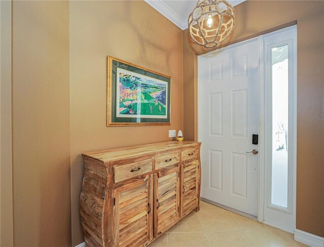 4570 Bridgepointe Way Unit 148, Vero Beach, FL 32967 - foyer featuring crown molding and light tile patterned floors