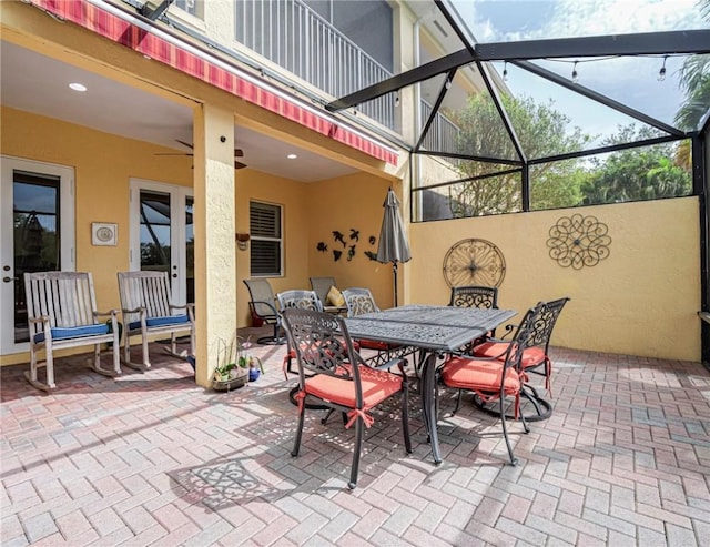 4570 Bridgepointe Way Unit 148, Vero Beach, FL 32967 - view of patio featuring glass enclosure and outdoor dining space
