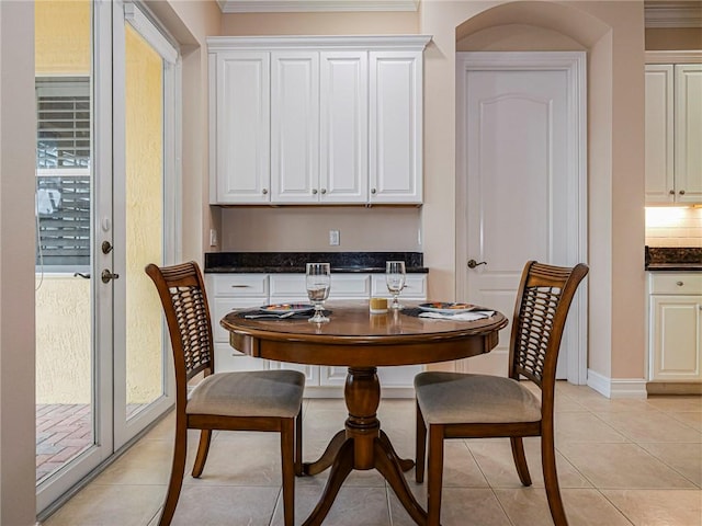 4570 Bridgepointe Way Unit 148, Vero Beach, FL 32967 - dining space featuring crown molding and light tile patterned floors
