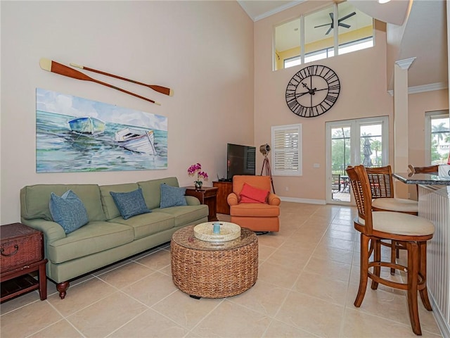 4570 Bridgepointe Way Unit 148, Vero Beach, FL 32967 - living area with crown molding, light tile patterned floors, a towering ceiling, and ceiling fan